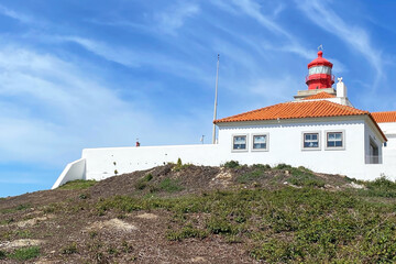 Beautiful old lighthouse against blue sky, Cape Da Roca, Cabo da Roca, Portugal