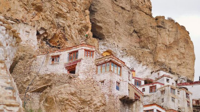 4K closeup shot of Phugtal Monastery made in a natural cave near Purne village in Zanskar, Ladakh India. Ancient monastery in a cave more than 2550 years ago in India. Monastery built inside the cave.
