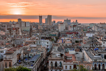 View over the rooftops of Havana in Cuba at sunset with the El National hotel