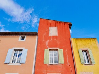 Fototapeta na wymiar Colorful house facade in scenic Luberon village Roussillon in Provence, France