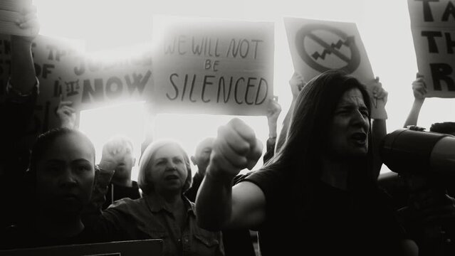 Demonstration of multiracial activists protesting against financial crisis and global inflation - Economic justice activism concept - Black and white editing