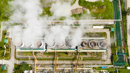 Aerial view of geothermal power plant in a mountainous province. Renewable energy production at a power station. Negros, Philippines.