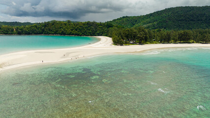 Tropical landscape with sandy beach and island. Kelambu Beach. Borneo, Malaysia.