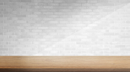 empty minimal table for product displayed. oak wooden table at foreground on white brick background with soft light beam. elegant scene for business advertising.