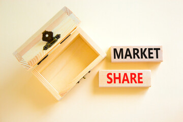 Market share symbol. Concept words Market share on beautiful wooden block. Beautiful white table white background. Empty wooden chest. Business and Market share concept. Copy space.