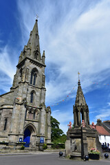 Falkland parish church  and Bruce fountain  under blue sky  at Scotland,victorian Gothic style