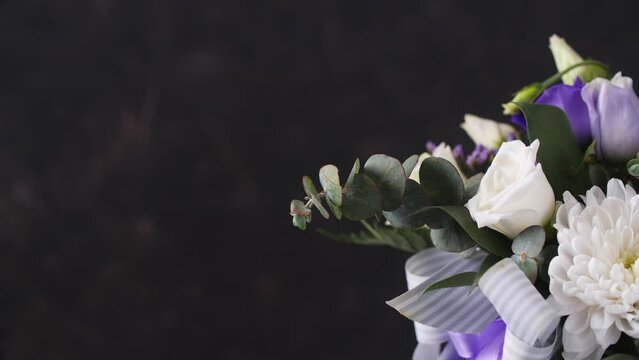 Beautiful composition, bouquet of white and violet roses. Close up. Copy space
