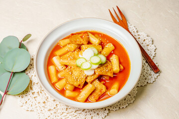 Tteokbokki, Stir-fried Rice Cake : Sliced rice cake bar (garaetteok) or thin rice cake sticks (Tteokbokkitteok) stir-fried in a spicy gochujang sauce with vegetables and fish cakes.
