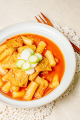 Tteokbokki, Stir-fried Rice Cake : Sliced rice cake bar (garaetteok) or thin rice cake sticks (Tteokbokkitteok) stir-fried in a spicy gochujang sauce with vegetables and fish cakes.