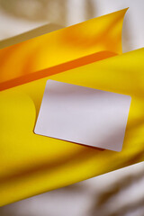 Blank business card, postcard on a colored background. Place for text and information. Mockup