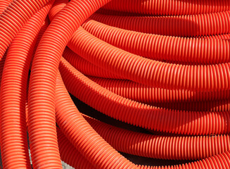 Polymer tubes. Abstract red background.