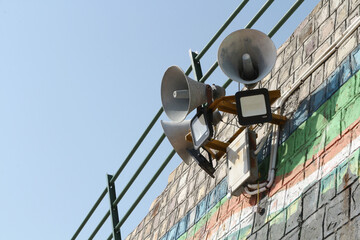 Obraz premium Loudspeakers on a wall in Rishikesh, India.