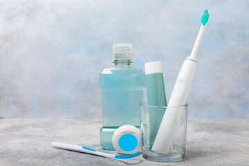 Bathroom with sonic electric toothbrush, toothpaste, mouthwash, dental floss and tongue cleaner...