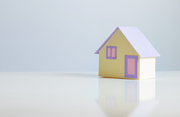 little paper house on white background