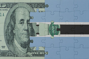 puzzle with the national flag of botswana and dollar money banknote. macro.concept.