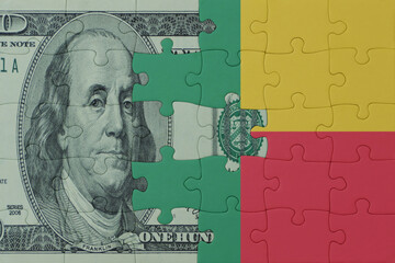 puzzle with the national flag of benin and dollar money banknote. macro.concept.