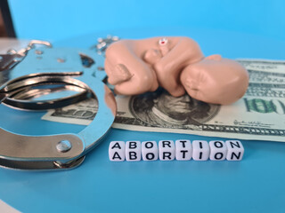 Paid illegal abortion and bribe to doctor