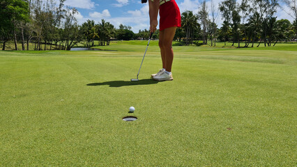 Golfer plays golf on golf course concept