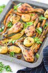 Baked chicken drumsticks with vegetables 