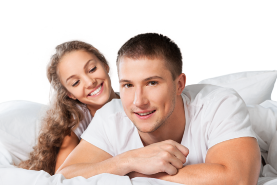 Happy mature couple lying on bed