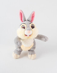 Fototapeta na wymiar Plush rabbit with pink ears. Soft toy for children on a white background.