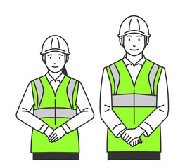 ヘルメットを被った作業着の男女