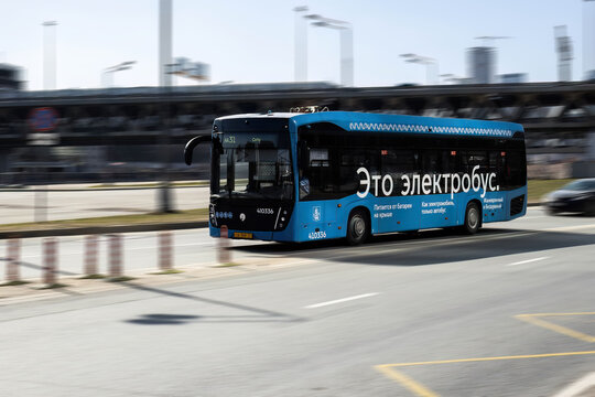 Electrobus drive down the street in Moscow, front side view. Electric bus in motion