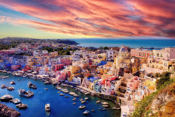 Procida, Corricella marina at sunset.
Panoramic view of the old village of fishermen's houses and the marina of Corricella, a classic panoramic view of the island of Procida, Italy.