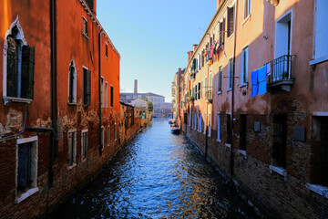Narrow canal between old residential buildings in Venice, Italy