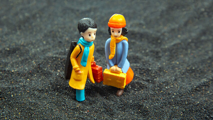 Naklejka premium miniature people. figures for the game. romantic couple of young people. boy and girl walking together
