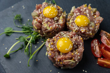meat tartare on a black board
