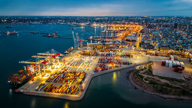 aerial of port harbour commercial cargo boat in Montevideo Uruguay illuminated at night