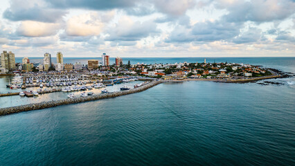 Fototapeta na wymiar Aerial view above Punta del Este seaside high rise resort cityscape on the coast of Uruguay