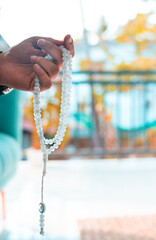 National mantra day concept image, hand holding Tasbih 