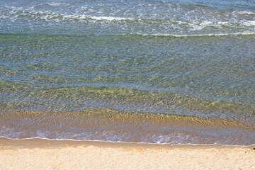Striking scene of waves breaking on the sand of a Spanish beach