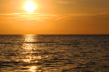 Fototapeta na wymiar Sunset on Mediterranean Sea. Cloudy day.