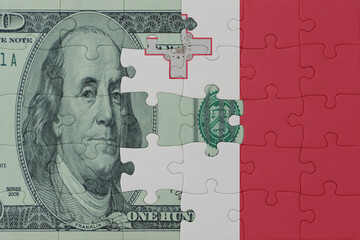 puzzle with the national flag of malta and dollar money banknote. macro.concept.