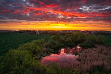 Amazing sunset over the spring fields of Rotmanka, Poland