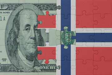 puzzle with the national flag of norway and dollar money banknote. macro.concept.