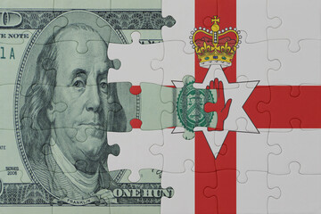 puzzle with the national flag of northern ireland and dollar money banknote. macro.concept.