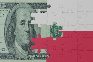 puzzle with the national flag of poland and dollar money banknote. macro.concept.