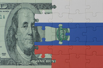 puzzle with the national flag of russia and dollar money banknote. macro.concept.