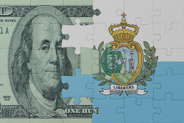 puzzle with the national flag of san marino and dollar money banknote. macro.concept.