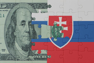 puzzle with the national flag of slovakia and dollar money banknote. macro.concept.
