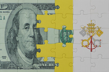 puzzle with the national flag of vatican city and dollar money banknote. macro.concept.