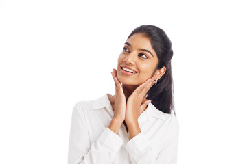 Happily surprised young business woman's portrait isolated on white.