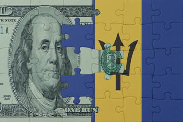 puzzle with the national flag of barbados and dollar money banknote. macro.concept.