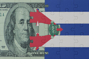 puzzle with the national flag of cuba and dollar money banknote. macro.concept.
