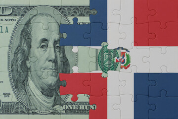 puzzle with the national flag of dominican republic and dollar money banknote. macro.concept.