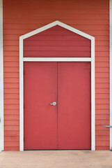 Colorful orange siding red exterior doors 